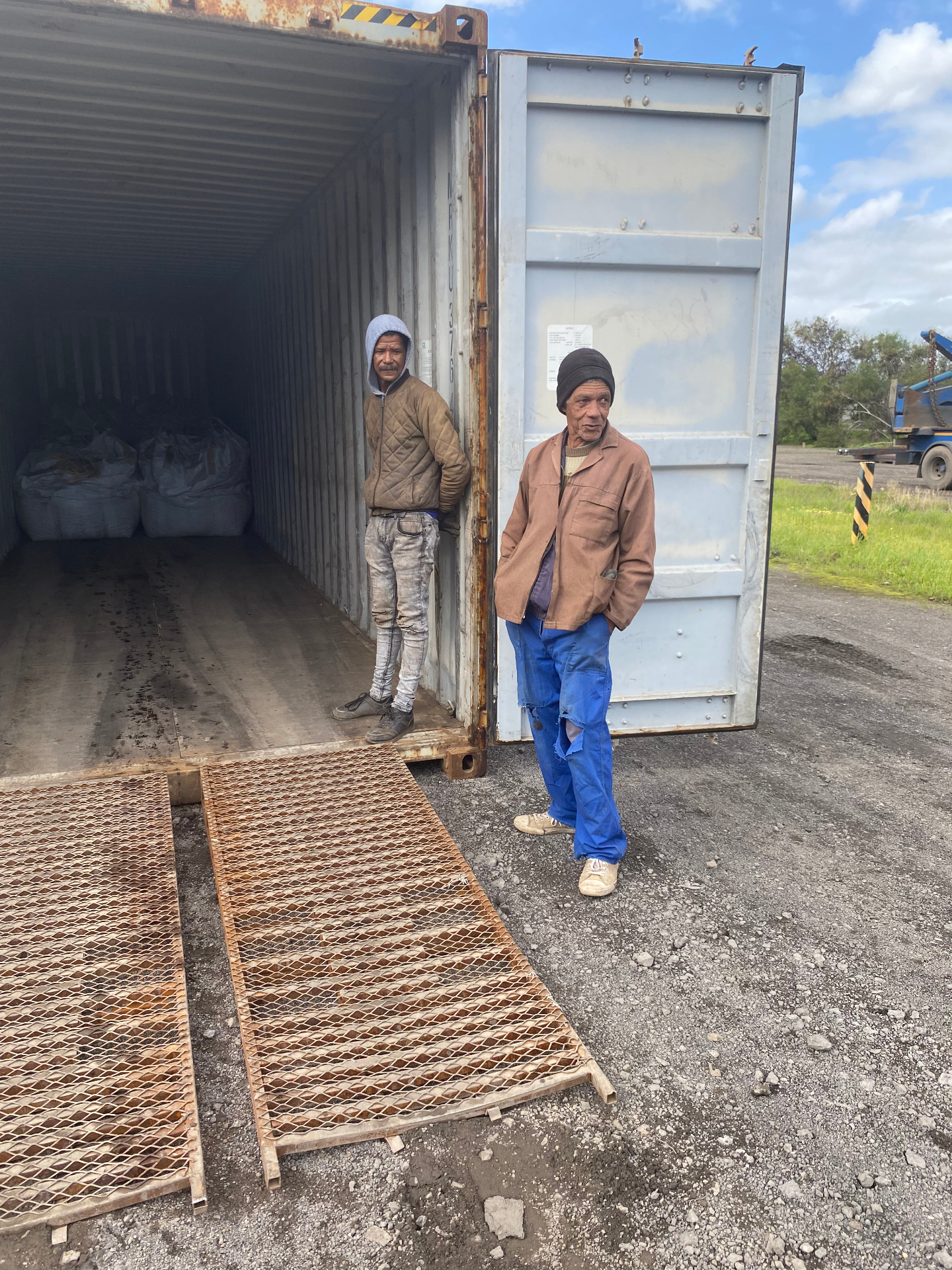 Team loading shipping containers